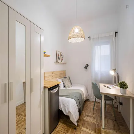 Rent this 11 bed room on Calle de Menorca in 28, 28009 Madrid