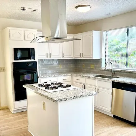 Rent this 4 bed apartment on 1848 Riverbend Crossing in Sugar Land, TX 77478