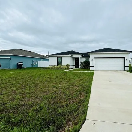 Rent this 4 bed house on 2304 Rio Grande Forest Ln in Poinciana, Florida