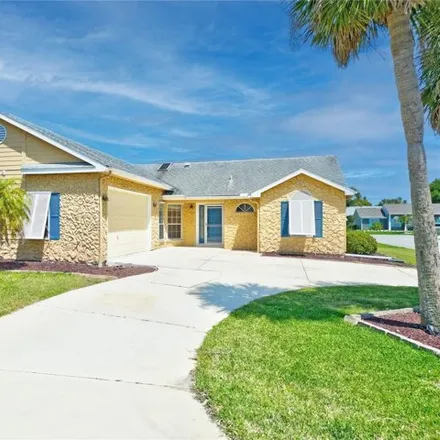 Buy this 3 bed house on 324 Citrus Open Drive in New Smyrna Beach, FL 32168