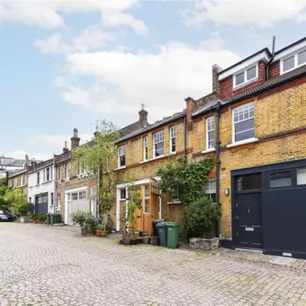 Rent this 4 bed townhouse on Daleham Mews in London, NW3 5QY