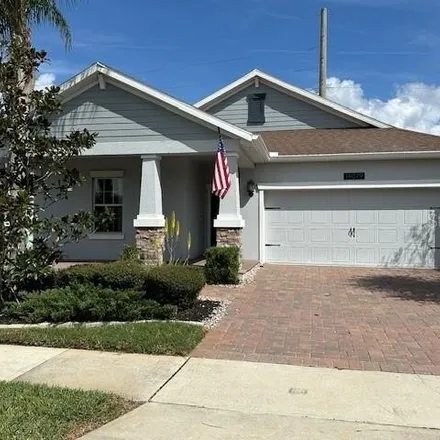 Rent this 4 bed house on 14075 Gold Bridge Drive in Meadow Woods, FL 32824