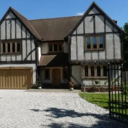 Rent this 5 bed house on Trumps Green Road in Trumpsgreen, GU25 4JA