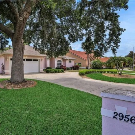 Buy this 4 bed house on Cypresswood Golf & Country Club in 1099 Clubhouse Road, Winter Haven