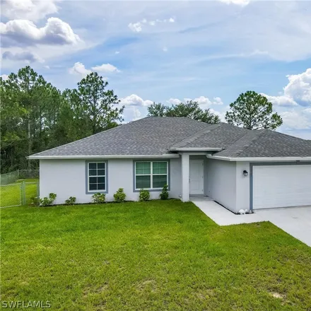 Rent this 3 bed house on 6th Street West in Lehigh Acres, FL 33971