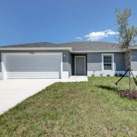 Buy this 4 bed house on 1337 Southwest Vicuna Lane in Port Saint Lucie, FL 34953