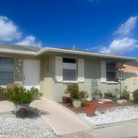 Buy this 2 bed townhouse on 962 Sumter Road East in Palm Beach County, FL 33415