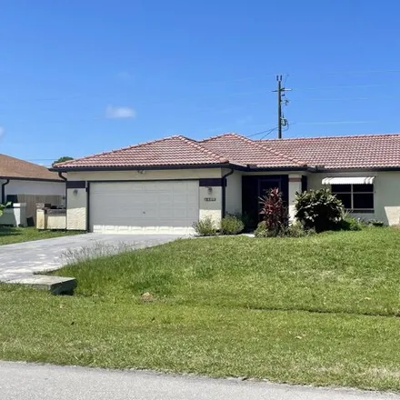 Buy this 3 bed house on 1577 SE Appamattox Ter in Port Saint Lucie, Florida
