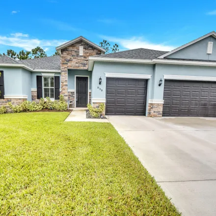 Buy this 4 bed house on 898 Doat Street Southeast in Palm Bay, FL 32909