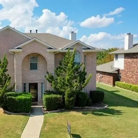 Rent this 4 bed house on 3055 Creek Valley Drive in Garland, TX 75040