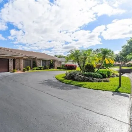 Buy this 4 bed house on 8551 Northwest 53rd Court in Pine Ridge, Coral Springs