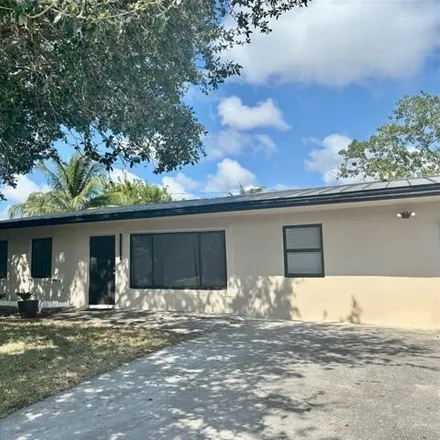 Rent this 3 bed house on 3049 Northeast 11th Terrace in Cresthaven, Pompano Beach