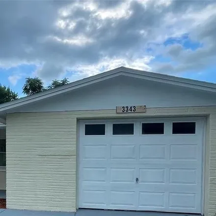 Buy this 3 bed house on 3343 Woodcock Drive in Elfers, FL 34690