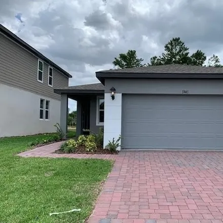 Rent this 4 bed house on 17443 Million Lakes Court in Clermont, FL