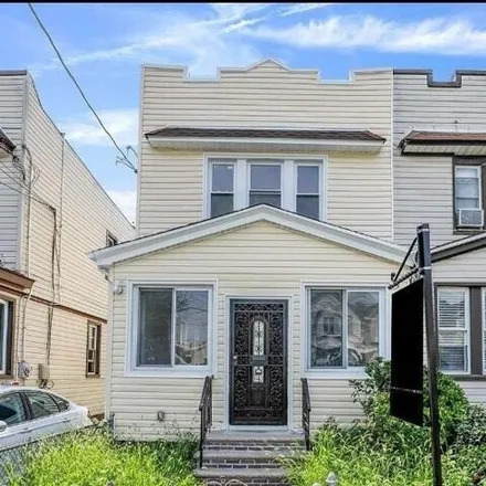 Buy this 3 bed house on 115-26 148th Street in New York, NY 11436