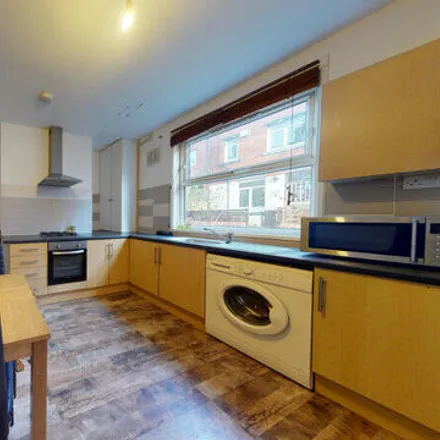 Rent this 4 bed townhouse on Spring Grove Walk in Leeds, LS6 1RR