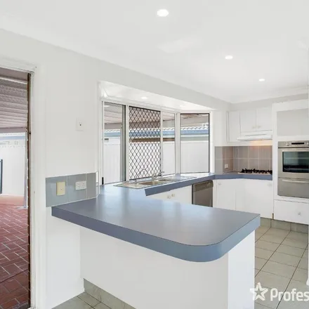 Rent this 4 bed apartment on Tattler Way in Burleigh Waters QLD 4220, Australia