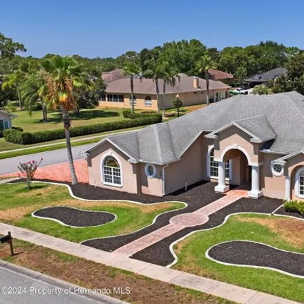 Buy this 5 bed house on 14199 Bocawood Drive in Spring Hill, FL 34609