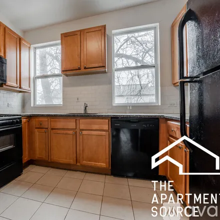 Rent this 4 bed duplex on 3800 W Diversey Ave
