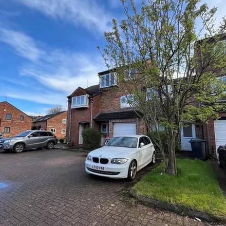 Rent this 3 bed townhouse on 2 Kensington Court in Wilmslow, SK9 5DA