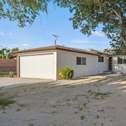 Rent this 4 bed house on 3422 Camden Street in Rosamond, CA 93560