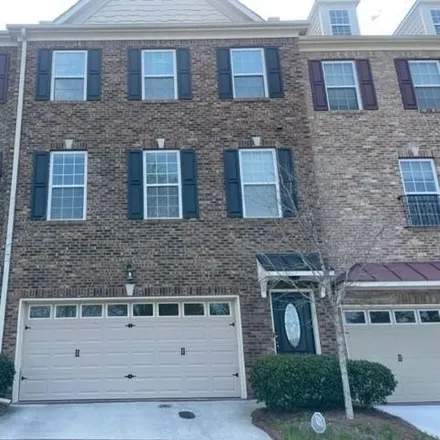 Rent this 3 bed townhouse on Windcrest Lane in Roswell, GA 30022