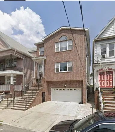 Rent this 3 bed house on 99 Grove Place in Bayonne, NJ 07002