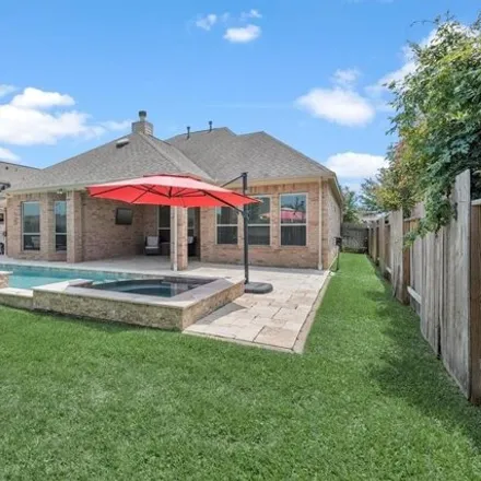 Buy this 4 bed house on 31936 Woodway Pines Drive in Harris County, TX 77447