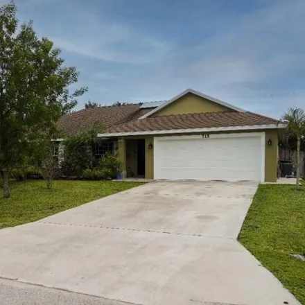 Buy this 4 bed house on 731 Southwest Saragossa Avenue in Port Saint Lucie, FL 34953