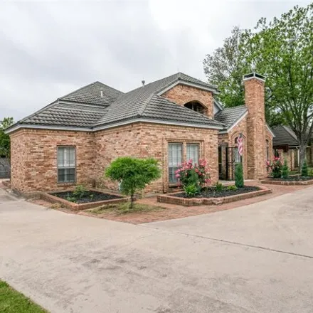Buy this 3 bed house on 2441 Stonegate Drive North in Bedford, TX 76021