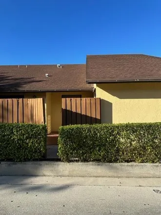 Buy this 2 bed townhouse on 859 Springdale Circle in Palm Springs, FL 33461