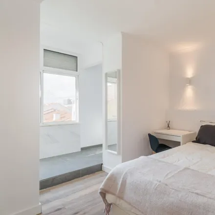Rent this 6 bed room on Rua Carrilho Videira in 1170-347 Lisbon, Portugal