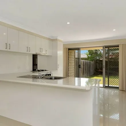 Rent this 4 bed townhouse on Bellagio Crescent in Coomera QLD 4209, Australia