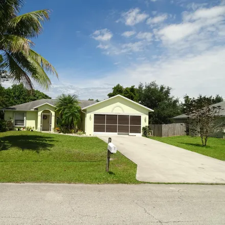 Buy this 3 bed house on 112 Southwest Carter Avenue in Port Saint Lucie, FL 34983