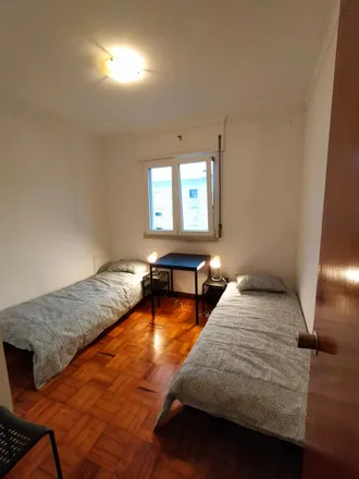 Rent this 4 bed room on Rua João Palma-Ferreira 424 in 1950-150 Lisbon, Portugal