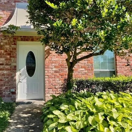 Rent this 4 bed townhouse on 11834 Village Park Circle in Houston, TX 77024