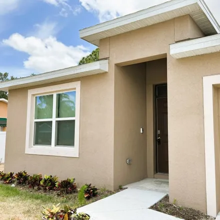 Rent this 4 bed house on 684 NW Treemont Avenue in Port St. Lucie, FL