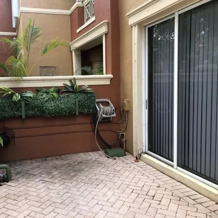 Rent this 2 bed townhouse on 6141 Northwest 115th Place in Doral, FL 33178