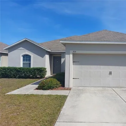 Rent this 3 bed house on Holly Berry Drive in Polk County, FL 33897