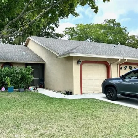 Buy this 2 bed house on 8951 Northwest 77th Street in Tamarac, FL 33321