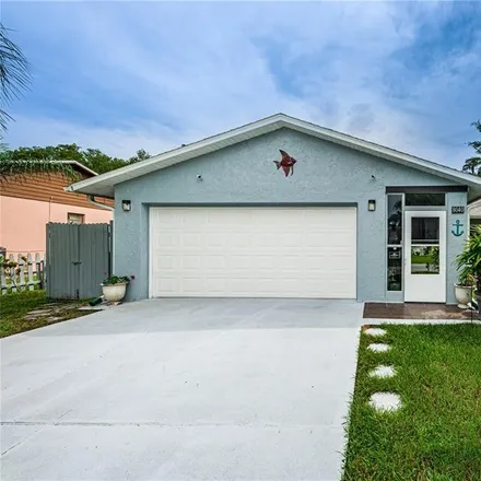 Buy this 3 bed house on 8030 Brown Pelican Avenue in Seven Springs, FL 34653
