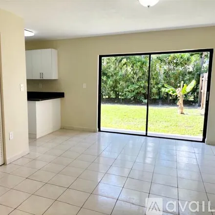 Rent this 4 bed townhouse on 10957 SW 25th St