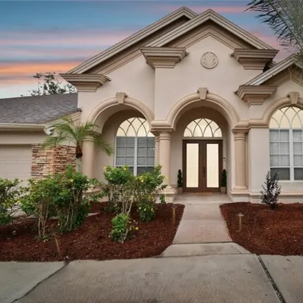 Buy this 6 bed house on 3896 Mullenhurst Dr in Palm Harbor, Florida
