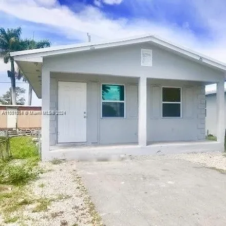 Buy this 3 bed house on 605 Amaryllis Avenue in Pahokee, Palm Beach County