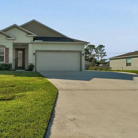 Buy this 3 bed house on 1502 Southwest Kosnar Avenue in Port Saint Lucie, FL 34953