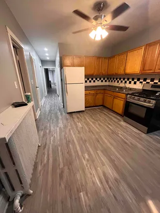 Rent this 3 bed apartment on 3839 W Wrightwood Ave