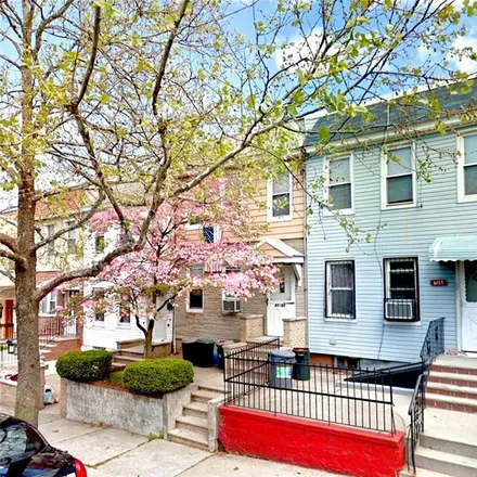 Buy this 3 bed townhouse on 61-51 55th Street in New York, NY 11378