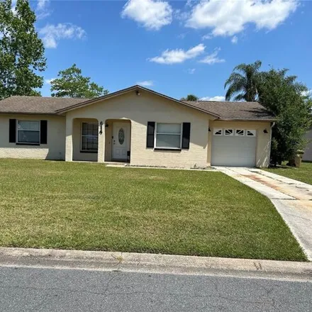 Rent this 3 bed house on 690 Redwood Court in Buenaventura Lakes, FL 34743