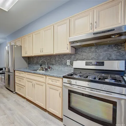 Buy this 5 bed townhouse on 62-70 81st Street in New York, NY 11379