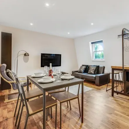 Rent this 2 bed townhouse on Coin Op Laundrette and Dry Cleaning in 288 King Street, London